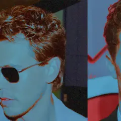 Zwei Männer mit stylischem fasson haarschnitt, einer trägt Sonnenbrille, der andere blickt ernst.