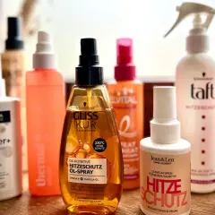 Hitzeschutzsprays von Gliss Kur, Taft, Balea & Co. schützen vor Hitze, nicht wie Haarspray die Haare kaputt machen.